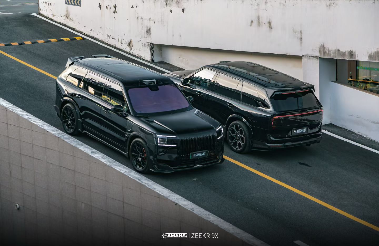 Two black ZEEKR 9X vehicles on road