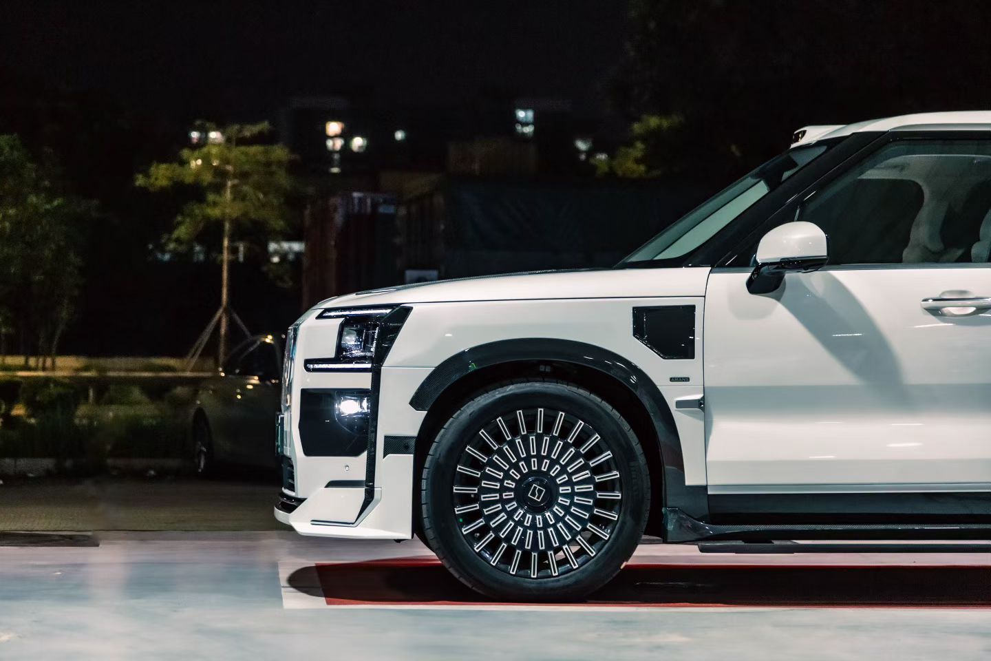 White ZEEKR 9X side profile with custom wheels